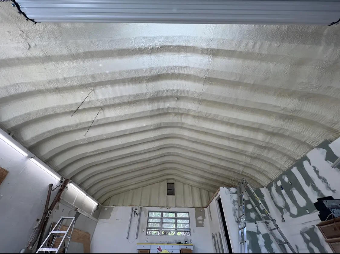 Spray polyurethane foam applied to the underside of a metal roof deck in Pilot Point